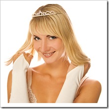 Beautiful blond girl with diamond diadem on her head isolated on